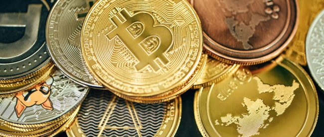 a pile of gold and silver bitcoins